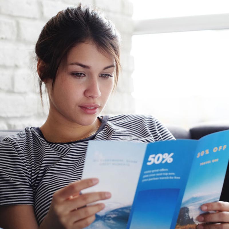 Woman reviewing high-quality brochure printing
